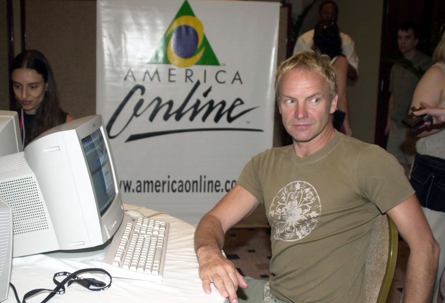 Sting in front of the America Online (AOL) logo