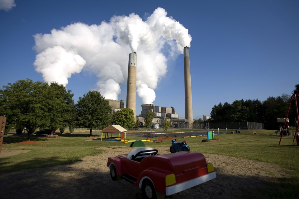 Coal smoke and steam vapor pour out of the Bruce Mansfield Power Plant across from a largely abandoned children's park in Shippingport, Pennsylvania prior to the plant shuttering in 2019.