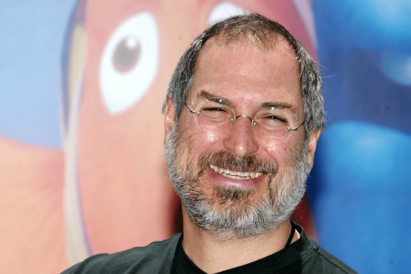 Steve Jobs behind a Nemo sign