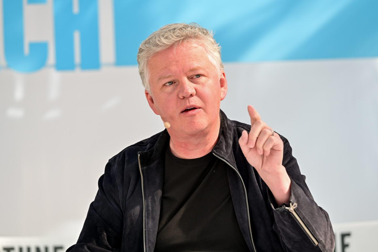Cloudflare CEO Matthew Prince raises a finger on stage