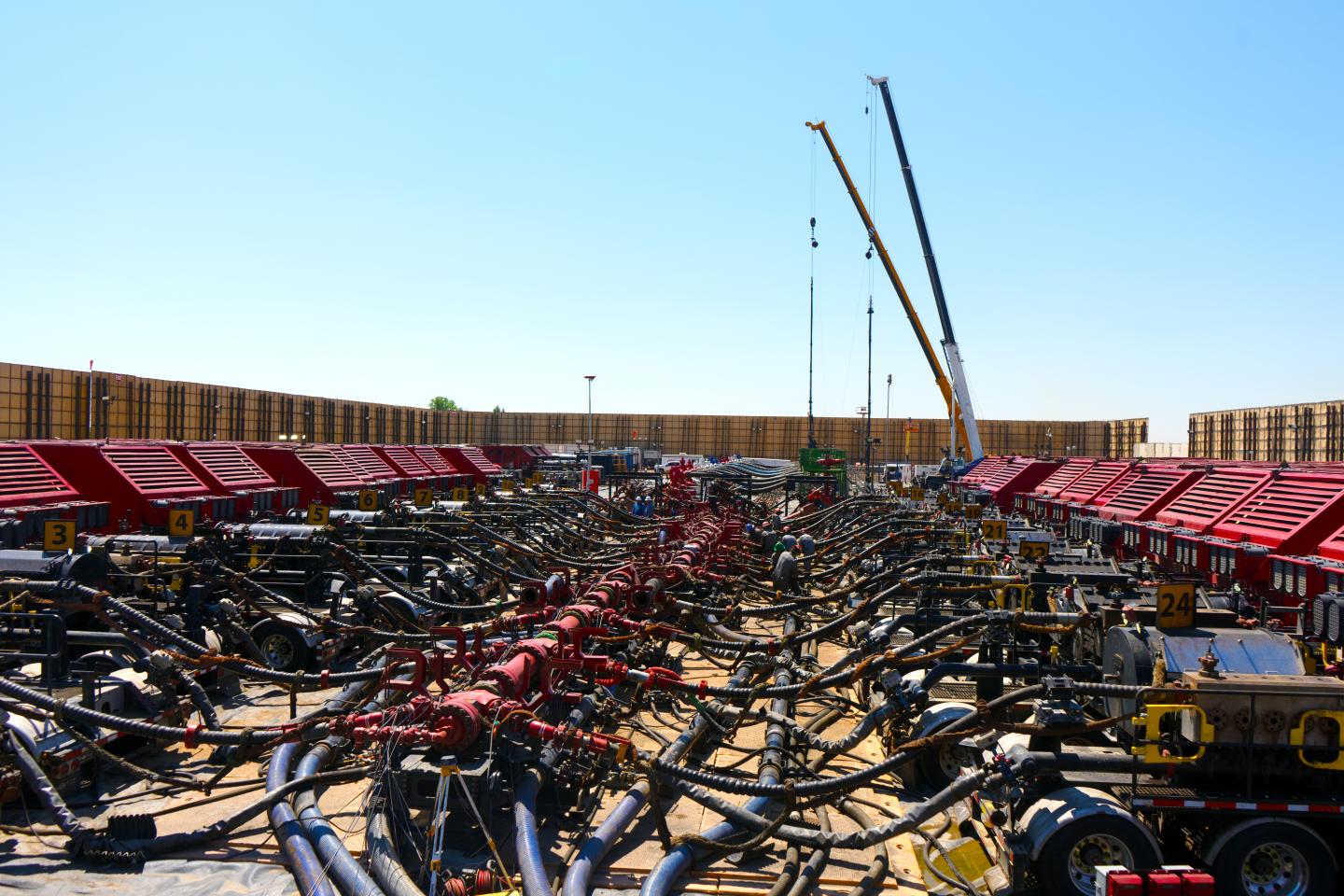A <a href="https://fortune.com/company/liberty-oilfield-services/" target="_blank">Liberty Energy</a> frac spread is shown void of people with all of the pressure pumping equipment in place to hydraulically fracture a subsurface well.