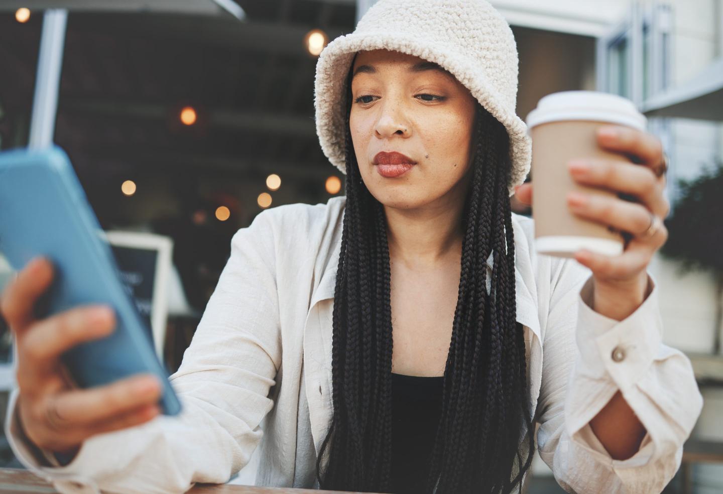 Gen Z woman on phone looking for new job