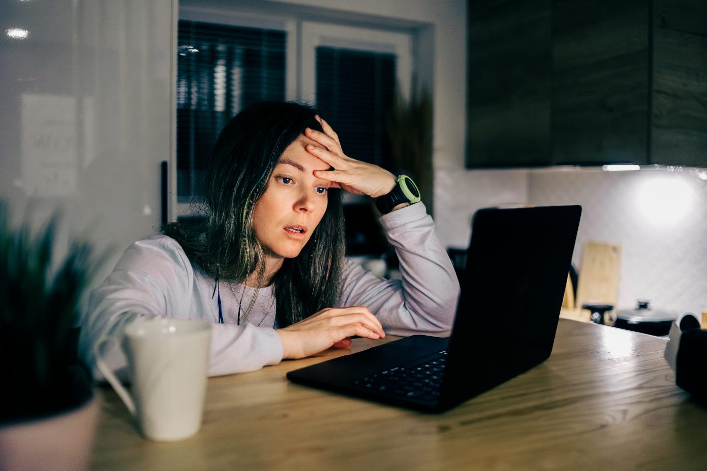 Sad worker at laptop