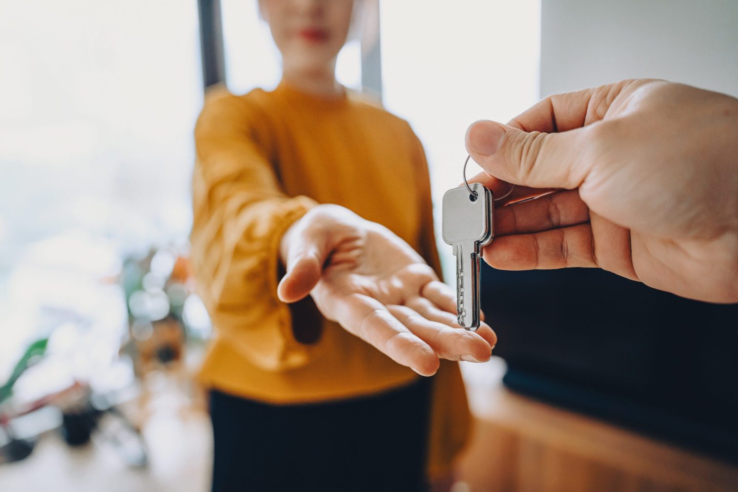 A person being handed keys