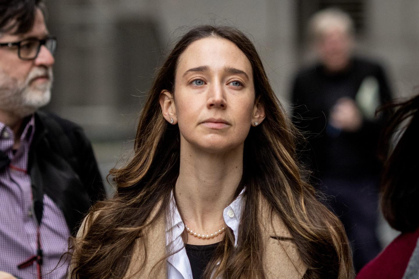 Charlie Javice leaving a courthouse