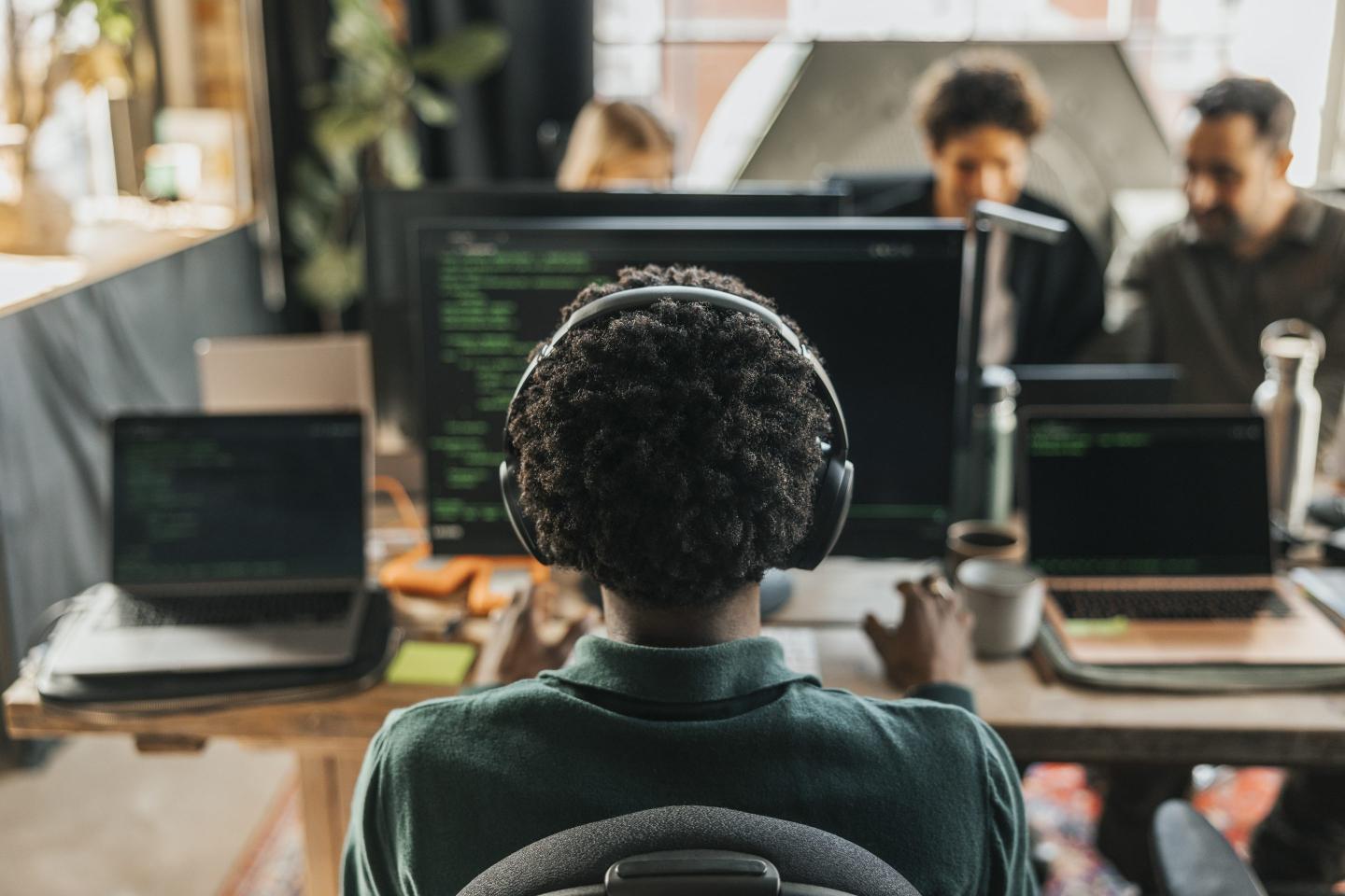 Software developer coding on their laptop.