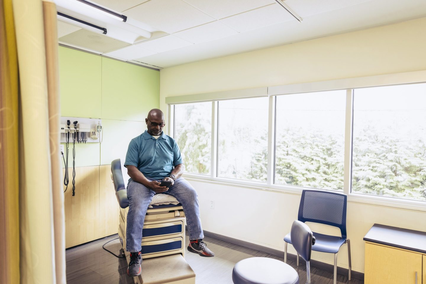 Man waiting for the doctor in an examination room