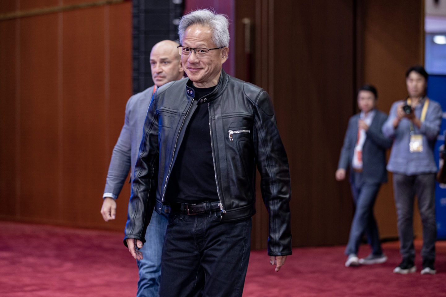 Nvidia CEO Jensen Huang dressed in his signature black jacket, black T-shirt, and black jeans.