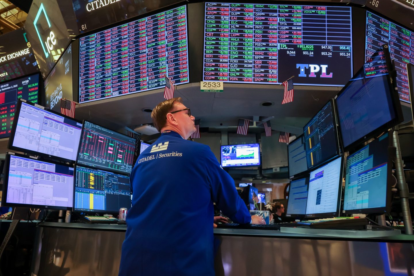 A trader works on the floor at the New York Stock Exchange on Tuesday.