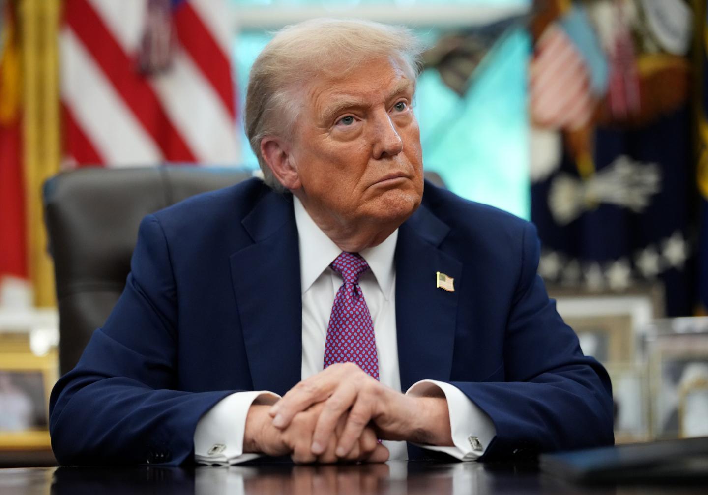 U.S. President Donald Trump speaks to the media while signing executive orders in the Oval Office of the White House on September 05, 2025 in Washington, DC.