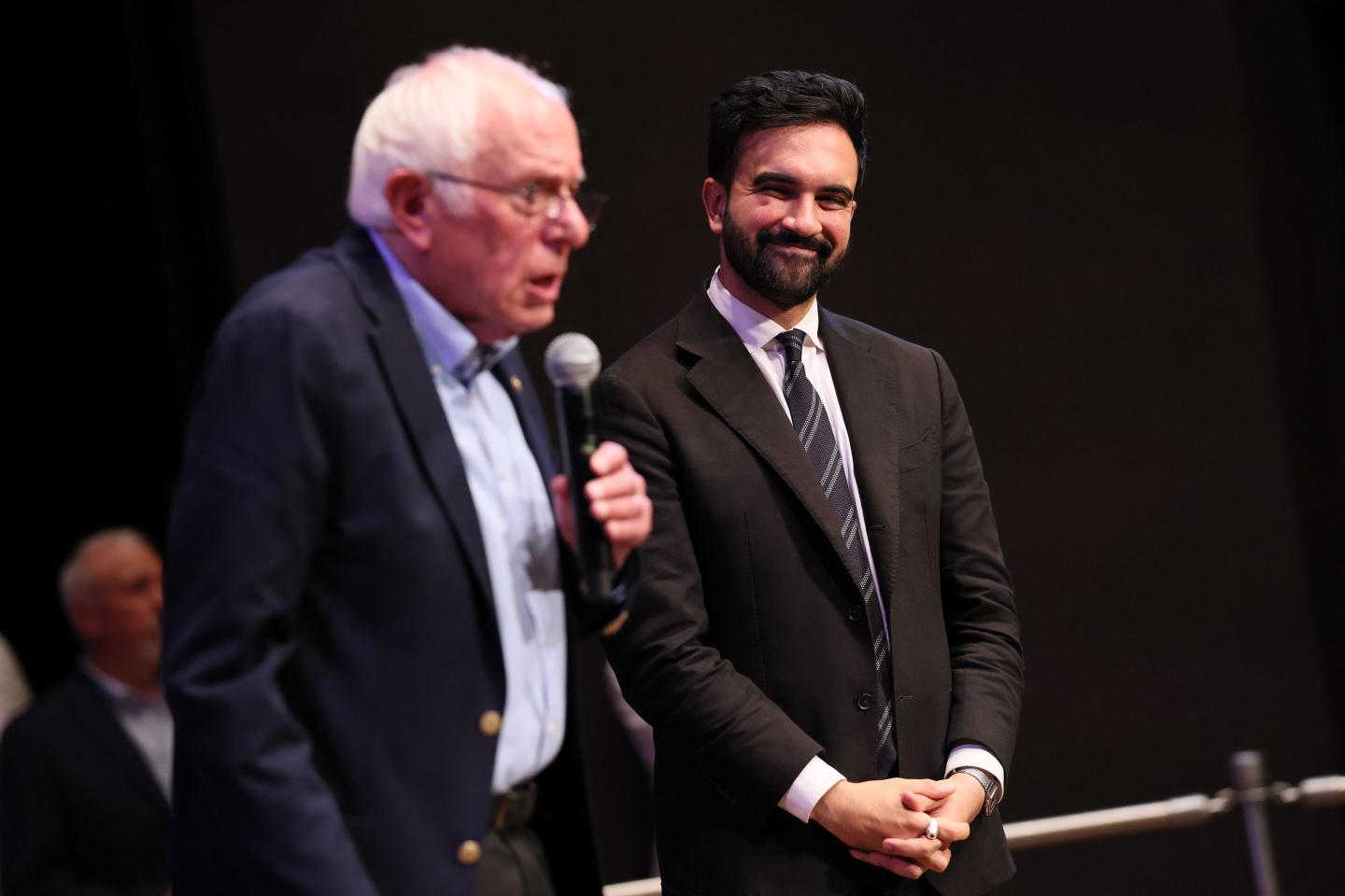 Sen. Bernie Sanders (I-VT) speaks as New York mayoral candidate Zohran Mamdani listens during the Fighting Oligarchy town hall at the Leonard & Claire Tow Center for the Performing Artson September 06, 2025 in New York City.