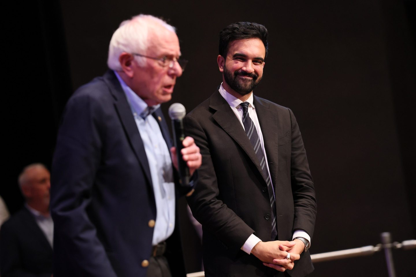 Sen. Bernie Sanders (I-VT) speaks as New York mayoral candidate Zohran Mamdani listens during the Fighting Oligarchy town hall at the Leonard & Claire Tow Center for the Performing Artson September 06, 2025 in New York City.