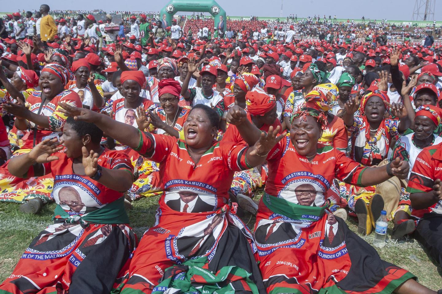 Malawi Congress Party (MCP) supporters dance during MCP's final campaign rally at Civo Stadium in Lilongwe, on September 13, 2025.
