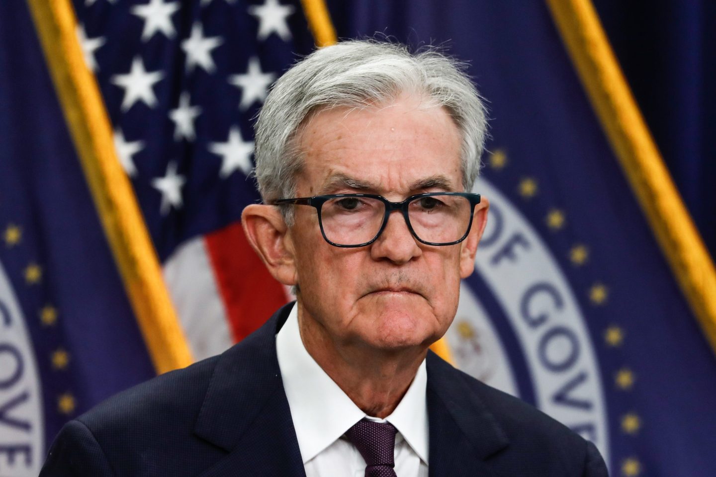 Federal Reserve Chair Jerome Powell frowns at the camera.