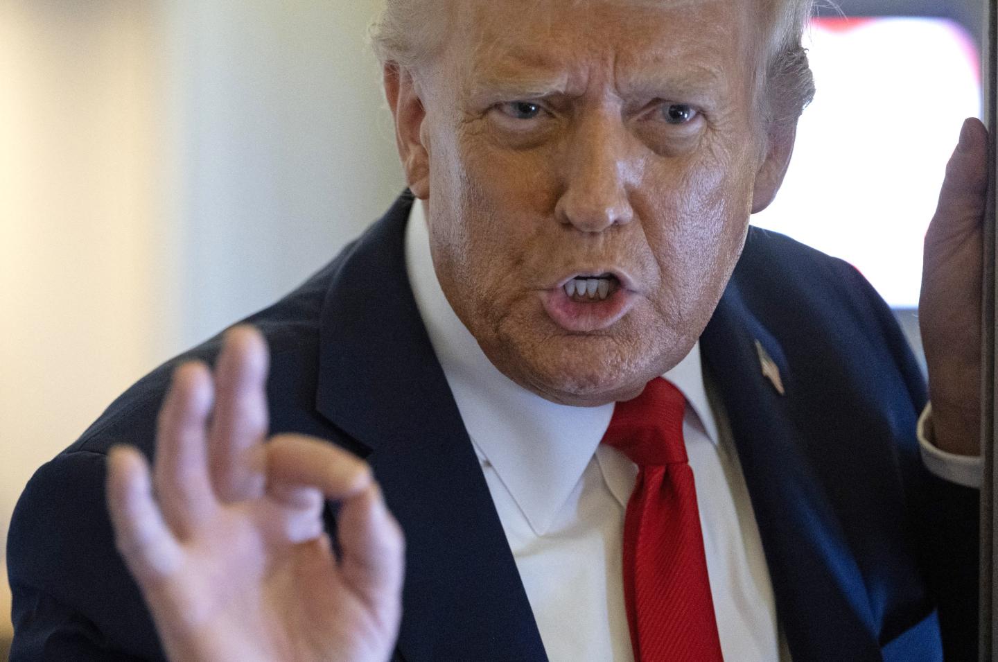 U.S. President Donald Trump speaks to the press as he flies back to the United States from the United Kingdom onboard Air Force One on September 18, 2025.