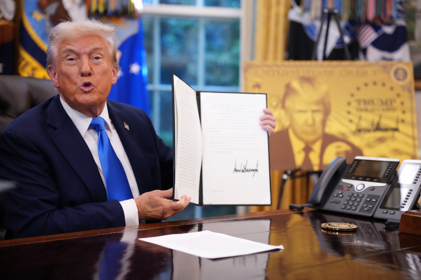 Trump signs an executive order.