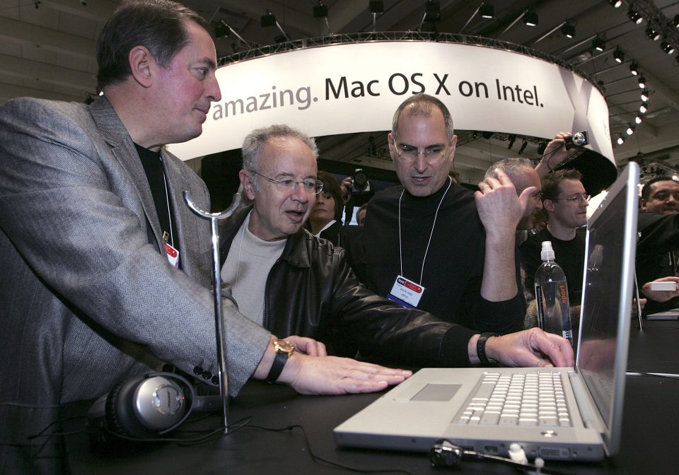 Former Intel CEOs Paul Otellini and Andy Grove, along with Apple's Steve Jobs— admire and Apple macbook powered by Intel chips
