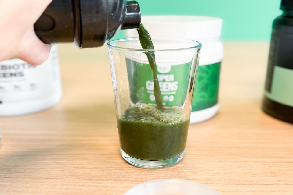 Pouring greens powder