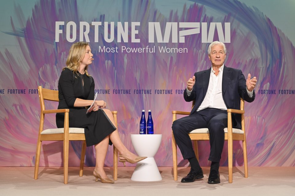 Alyson Shontell and Jamie Dimon at a conference on stage.