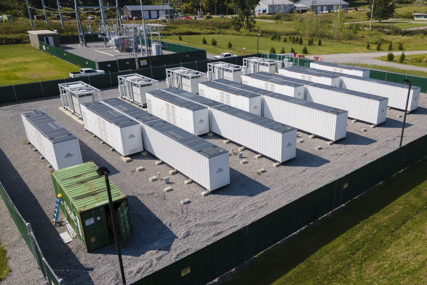 A large lithium battery energy storage system operated by Key Capture Energy that can power 15,000 homes for two hours during outages or high demand sits surrounded by a fence in Blasdell, N.Y., on Sept. 9.