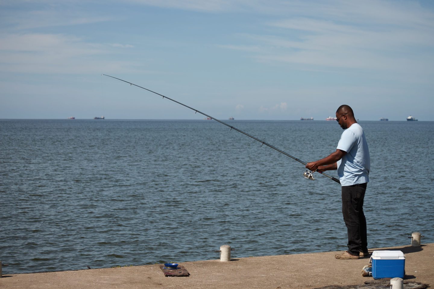 A man fishes in Cocorite, Trinidad and Tobago on Oct. 3