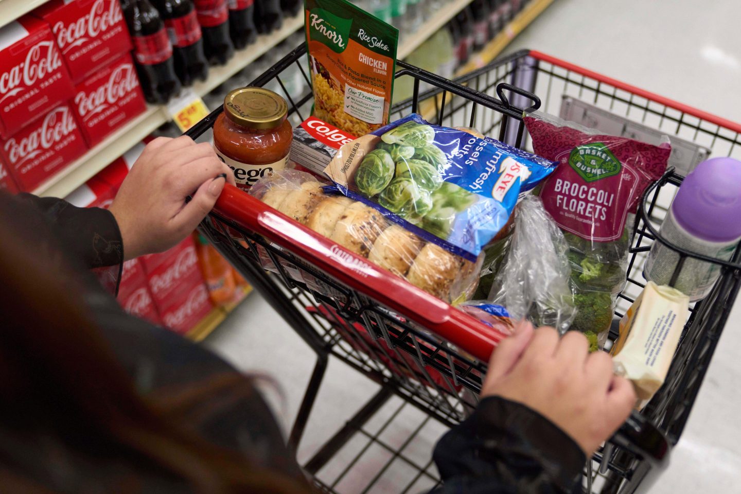 A California's SNAP benefits shopper pushes a cart through a supermarket in Bellflower, Calif., Feb. 13, 2023.
