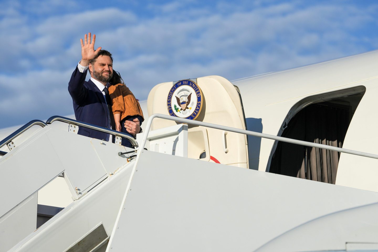 Vice President JD Vance waves as he boards Air Force Two at Joint Base Andrews, Md., Friday, Oct. 17, 2025. (Oliver Contreras/Pool via AP)