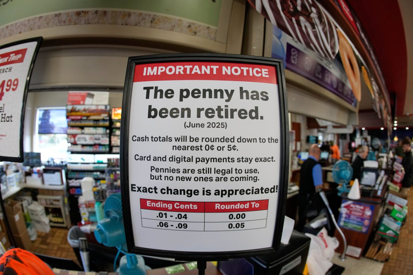 A sign in a Kwik Trip store shows the store will no longer be using pennies to give change, on Oct. 23, 2025, in Yorkville, Wis