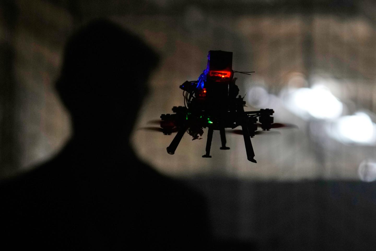 Colin Balfour, a sophomore studying robotics engineering, flies a small drone at a simulated night flight at a laboratory at the Worcester Polytechnic Institute, Monday, Oct. 20, 2025, in Worcester, Mass.