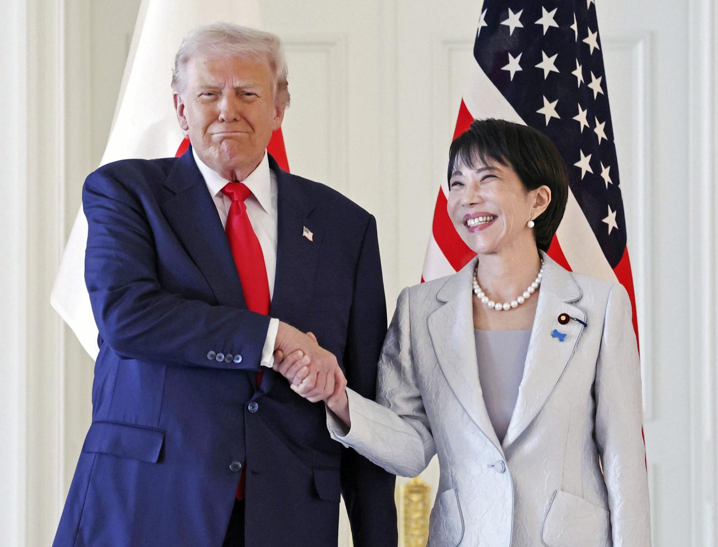 President Donald Trump, left, and Japanese Prime Minister Sanae Takaichi shake hands before their summit talk at Akasaka Palace in Tokyo, Tuesday, Oct. 28, 2025.