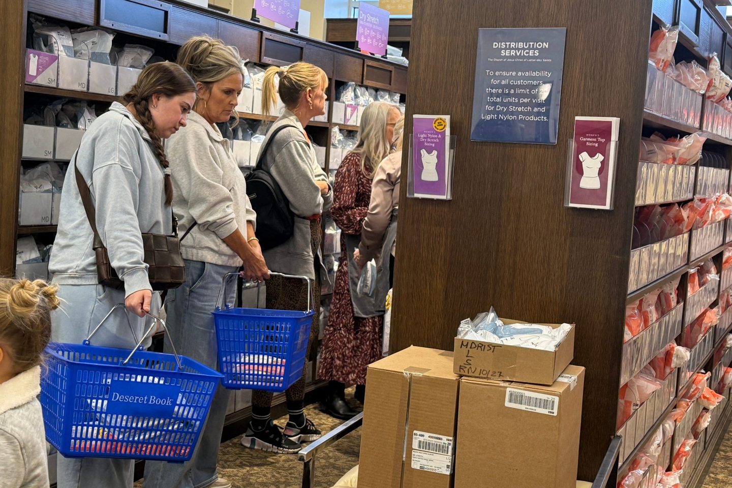 Members of The Church of Jesus Christ of Latter-day Saints shop for new sleeveless sacred garments.