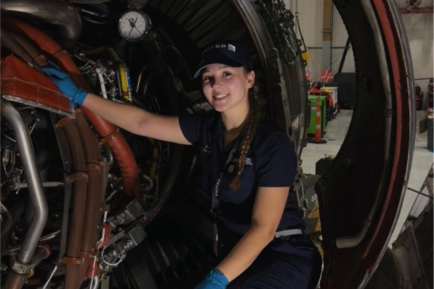 Bianca Miller behind a jet engine