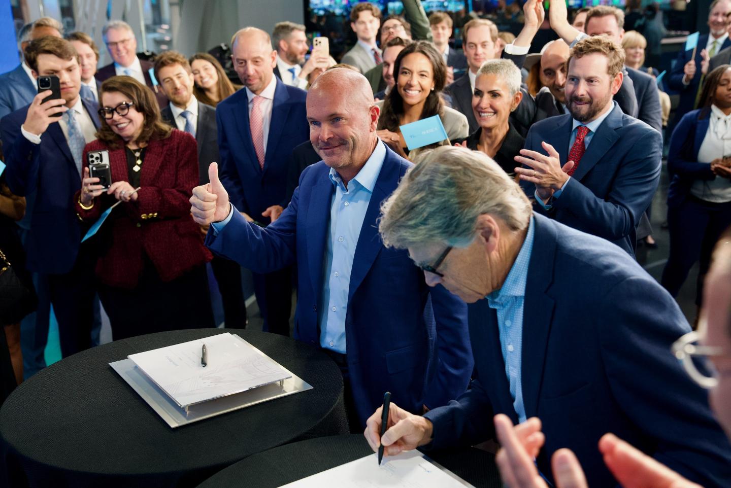 Fermi Inc. cofounders Toby Neugebauer, left, and former Texas Gov. Rick Perry, right, mark their Nasdaq IPO in early October for their AI power company plans.