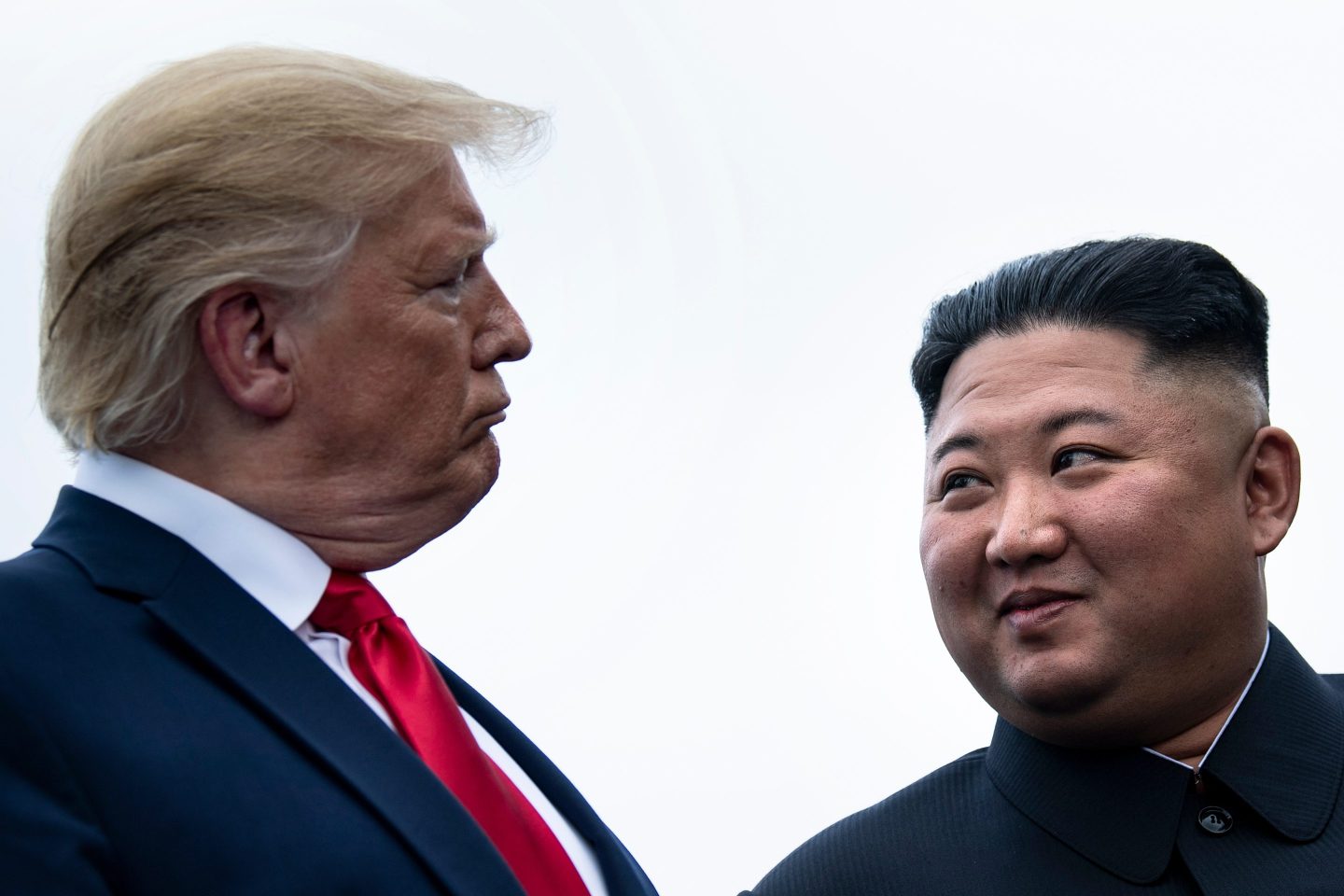 US President Donald Trump and North Korea's leader Kim Jong-un talk before a meeting in the Demilitarized Zone(DMZ) on June 30, 2019, in Panmunjom, Korea.