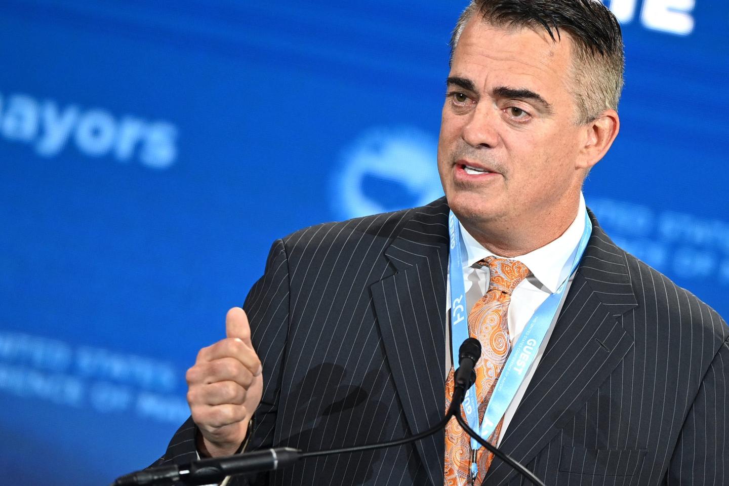 Axon Enterprise CEO Rick Smith in a dark suit