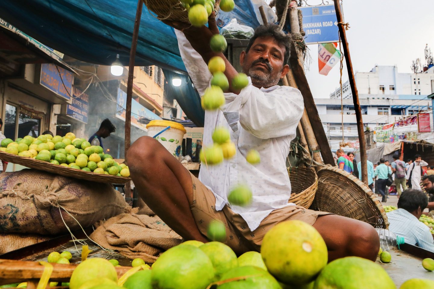 A vendor arranges lemons at a wholesale vegetable market in Kolkata, India, on February 18, 2025.