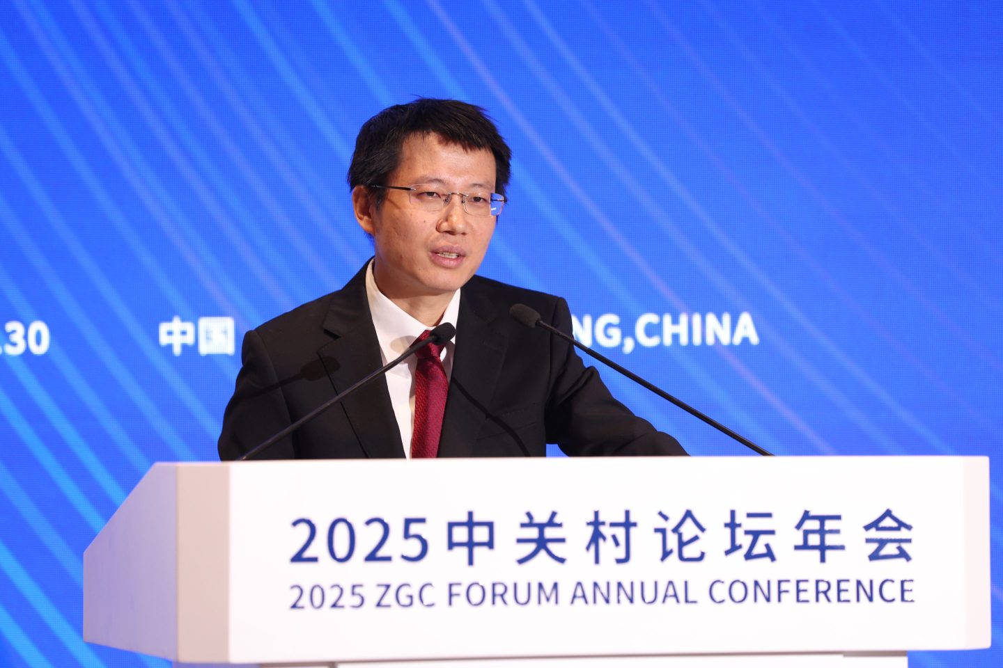 Chen Tianshi, CEO and founder of Cambricon, speaks at a podium