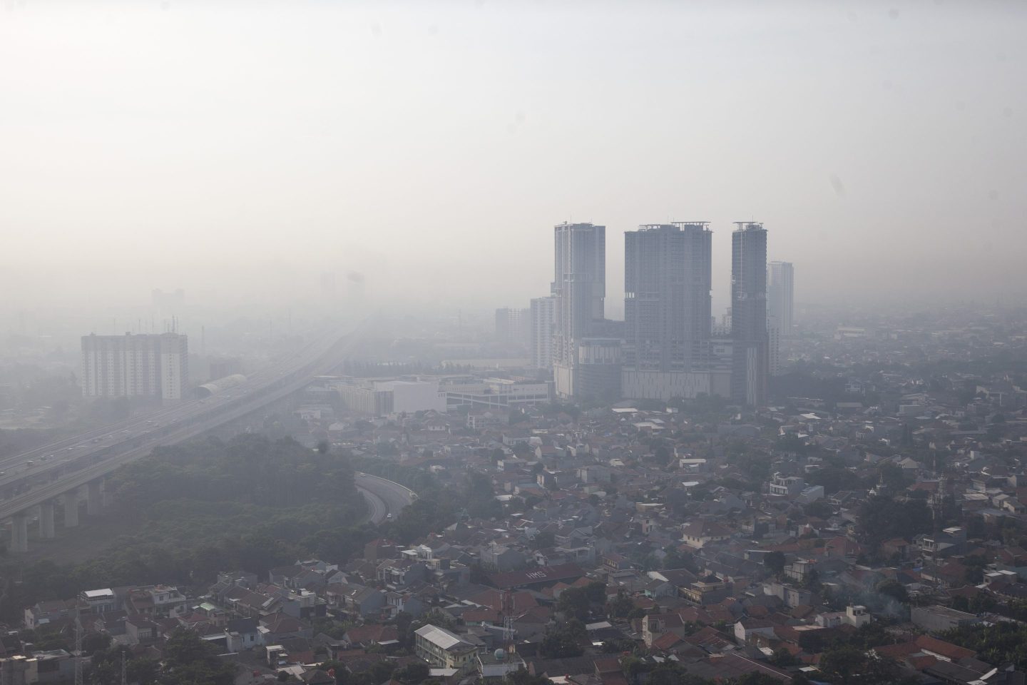 An aerial view shows Bekasi city, an industrial city located only 22 kilometers from the center of Jakarta, covered in air pollution haze in Bekasi, Indonesia, on May 9, 2025.