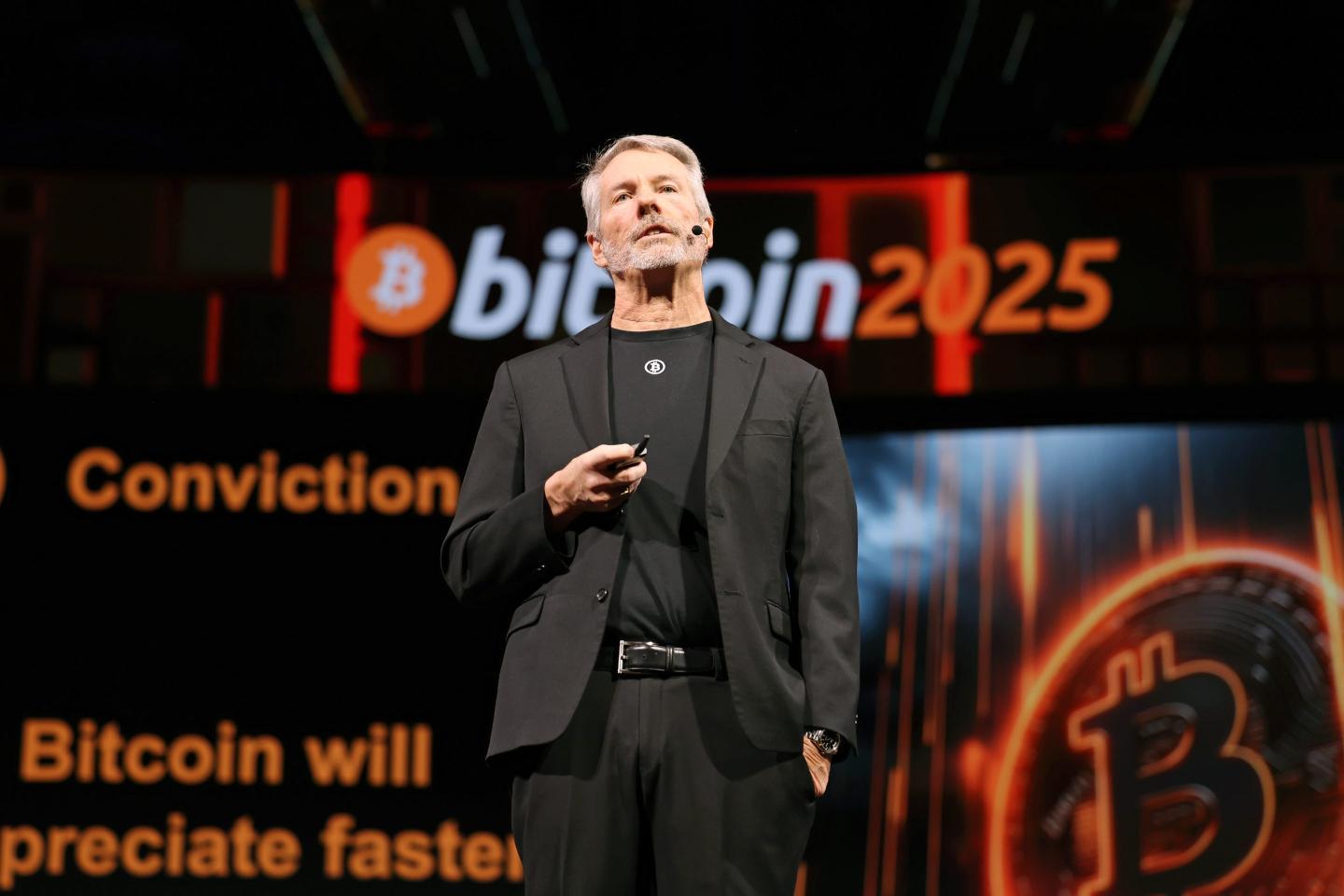 Michael Saylor on stage at a Bitcoin conference.