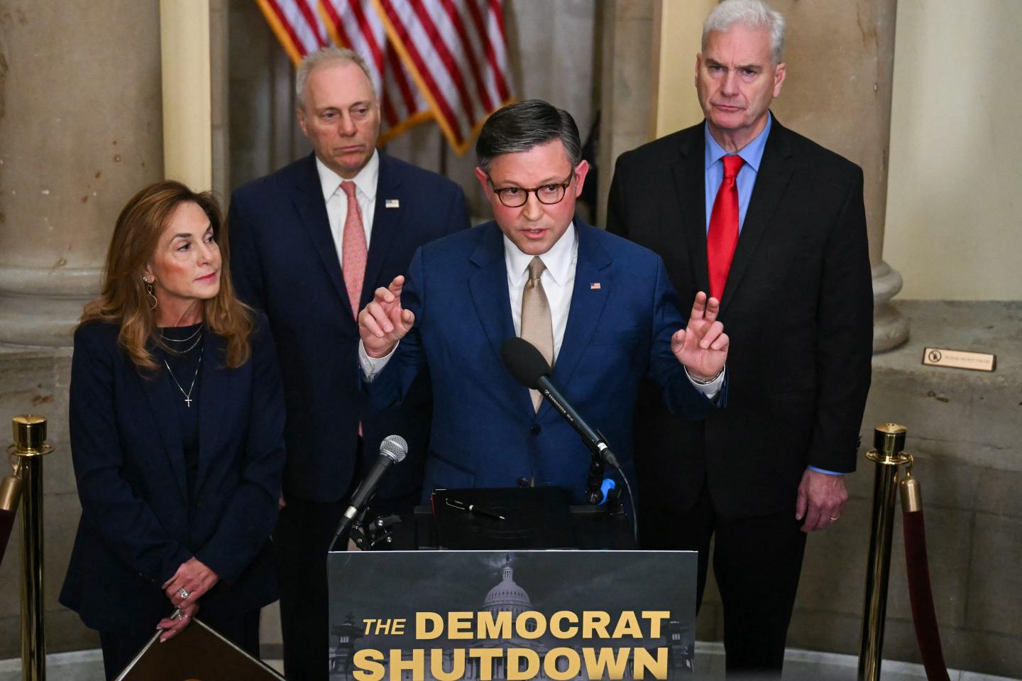 US Speaker of the House Mike Johnson, Republican from Louisiana, speaks during a news conference outside of his office at the US Capitol on the second day of the US government shutdown in Washington, DC, on October 2, 2025, alongside, L/R, Representative Lisa McClain, Republican from Michigan, House Majority Leader Steve Scalise, Republican from Louisiana, and House Majority Whip Tom Emmer, Republican from Minnesota.
