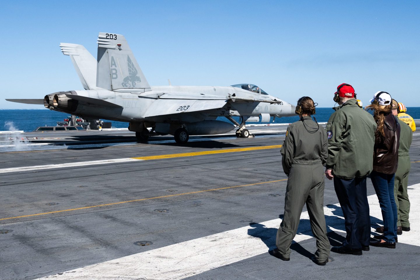 President Donald Trump and First Lady Melania Trump watch a US Navy FA-18 take off during a visit to the USS George H.W. Bush aircraft carrier which is out at sea near Norfolk, Virginia, on Oct. 5.