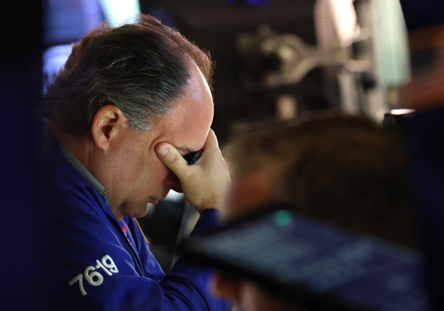 Photo: A trader works at his desk on the floor of the New York Stock Exchange (NYSE) in New York on October 7, 2025. Wall Street stocks edged higher early Tuesday, extending an upbeat stretch as markets continue to look past a US government shutdown that has curtailed economic data releases. (Photo by TIMOTHY A. CLARY / AFP) (Photo by TIMOTHY A. CLARY/AFP via Getty Images)