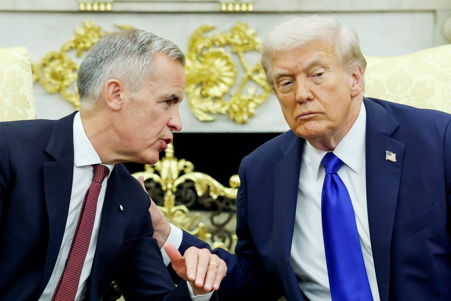 U.S. President Donald Trump (R) and Canadian Prime Minister Mark Carney speak to reporters in the Oval Office of the White House on October 07, 2025 in Washington, DC.