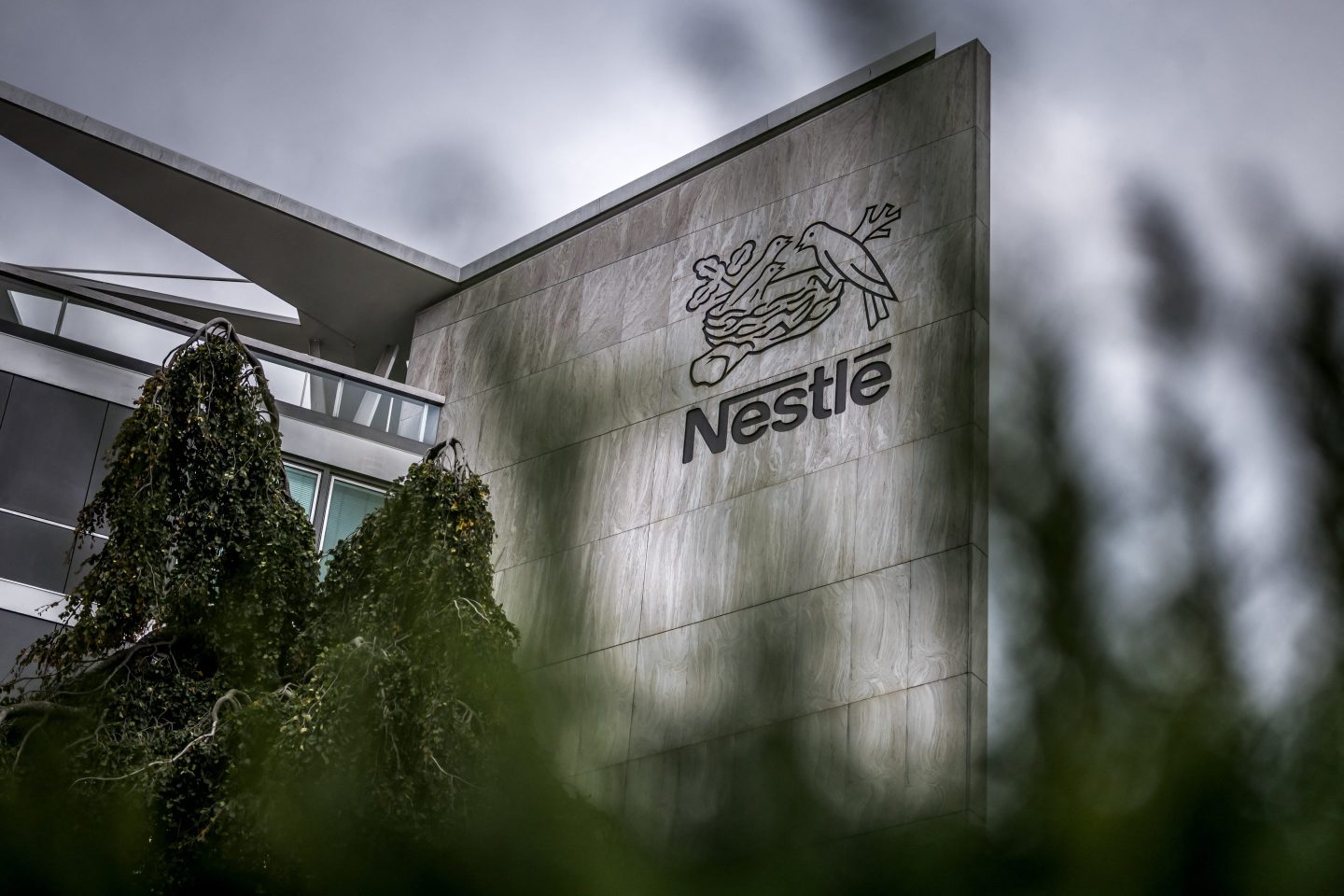 Logo of Swiss food giant Nestle on the facade of its headquarters ahead of the company's third-quarter results announcement, in Vevey, western Switzerland, on October 14, 2025.