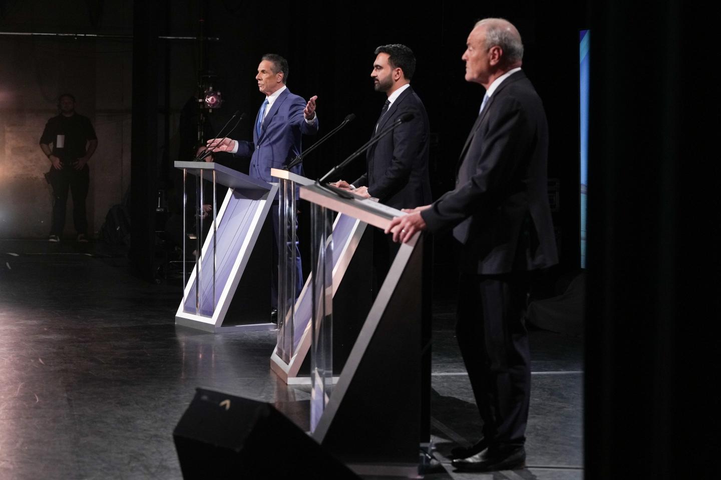 Andrew Cuomo, New York City mayoral candidate, from left, Zohran Mamdani, New York City mayoral candidate, and Curtis Sliwa, New York City mayoral candidate, during a mayoral debate in New York, US, on Wednesday, Oct. 22, 2025.