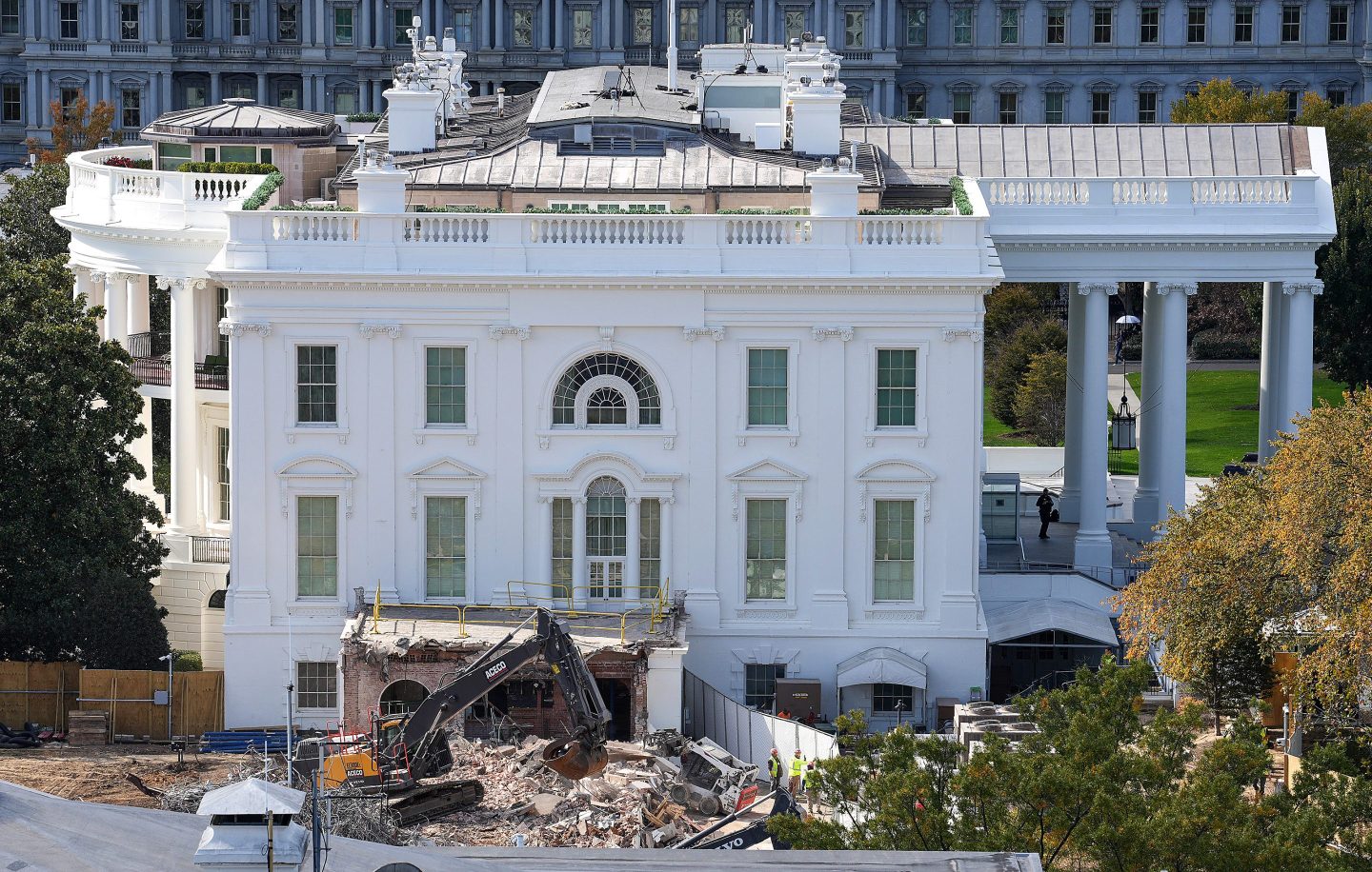 An excavator works to clear rubble after the East Wing of the White House was demolished on October 23, 2025 in Washington, DC. The demolition is part of U.S. President Donald Trump's plan to build a multimillion-dollar ballroom on the eastern side of the White House.