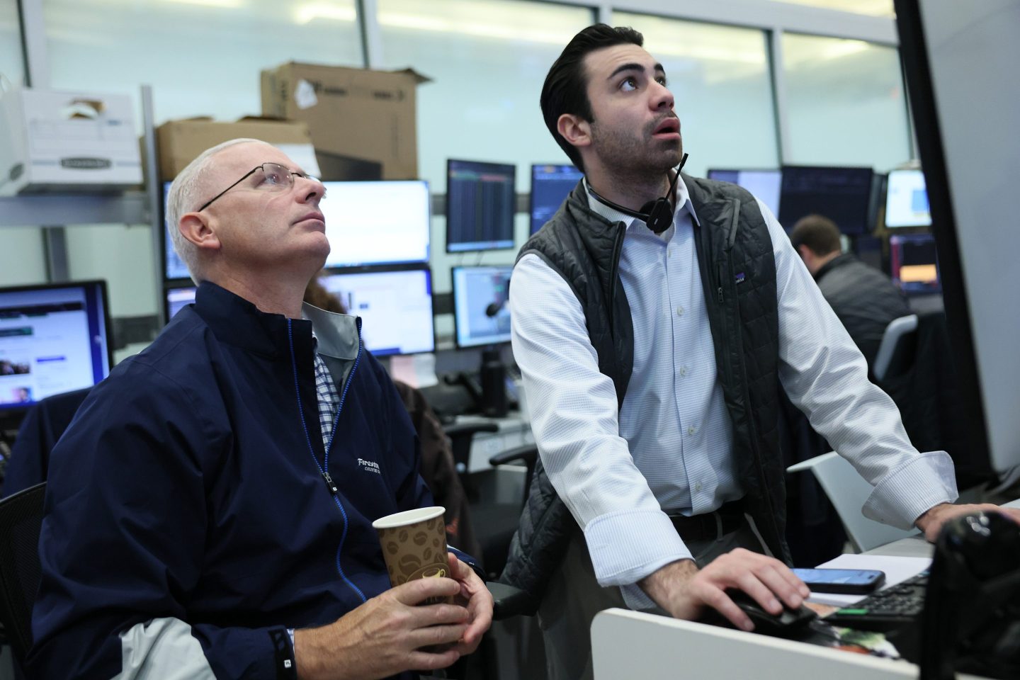 Traders work on the floor of the New York Stock Exchange during morning trading on October 27, 2025 in New York City.