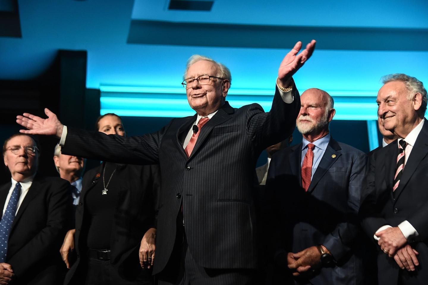 Philanthropist Warren Buffett is joined onstage by 24 other philanthropist and influential business people featured on the Forbes list of 100 Greatest Business Minds.