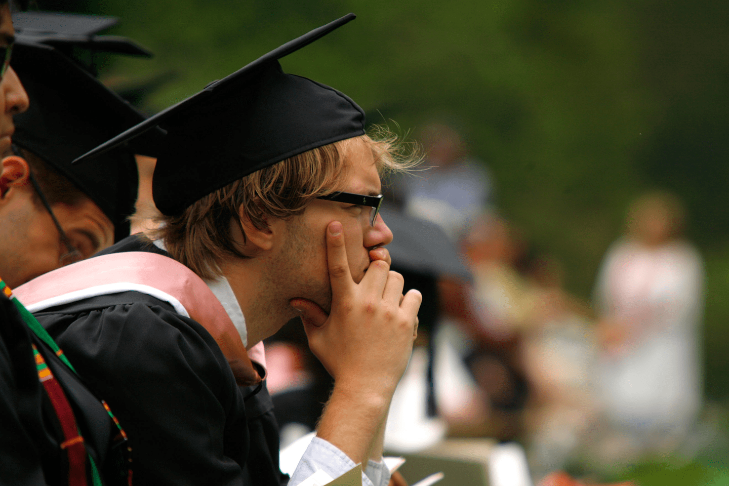 Graduate with his hands on his face