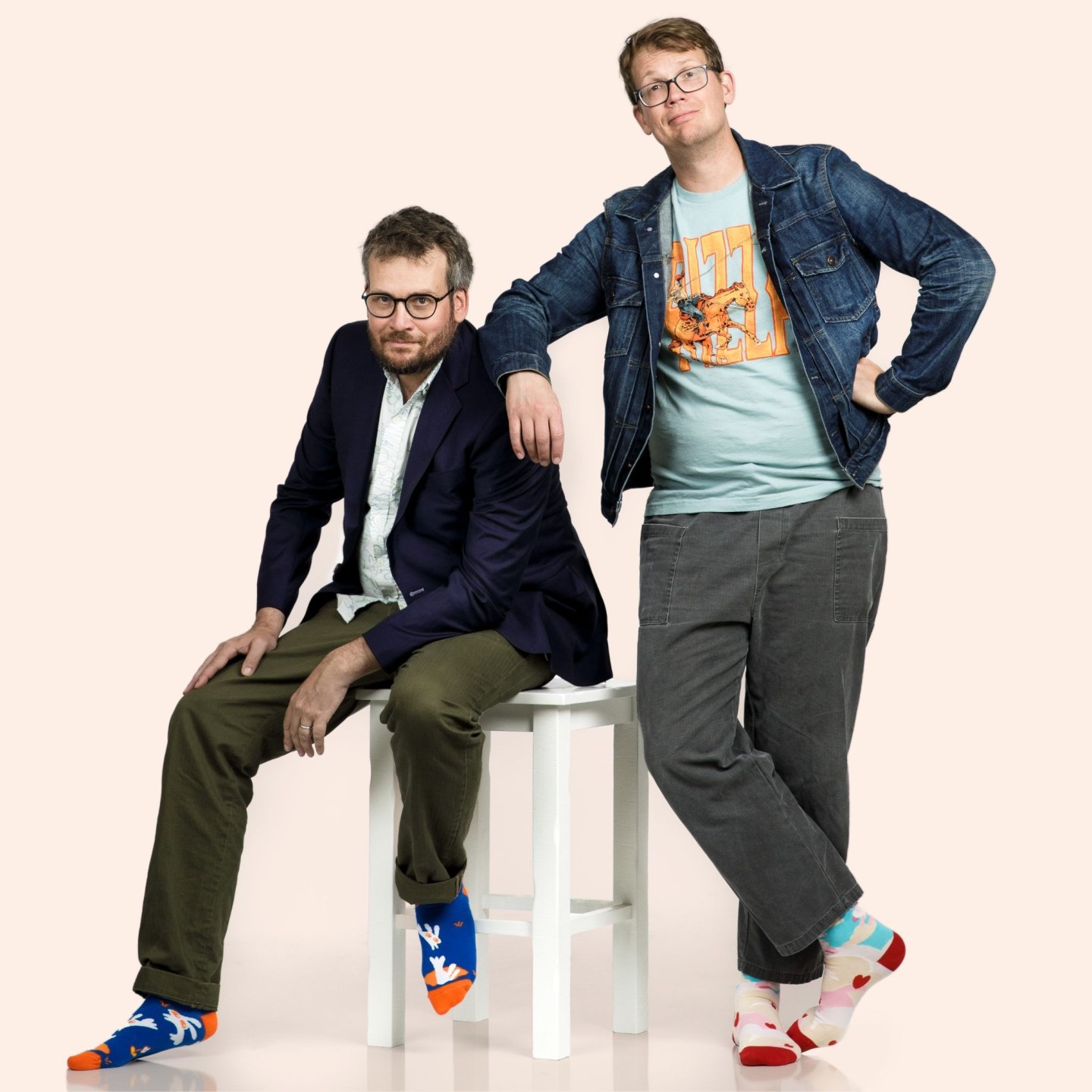 John Green, sitting, with his brother, Hank, leaning  on his shoulder